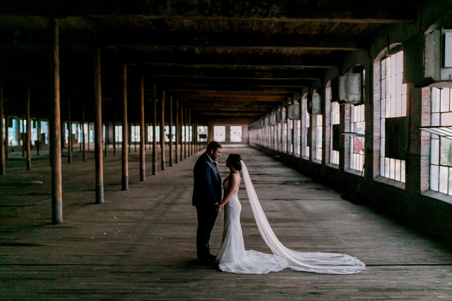 Virginia + Kory | emotional, industrial style wedding with dusty blue, ivory, and gold accents at the Mckinney Cotton Mill by North Texas Wedding Photographer Rachel Meagan Photography | 098