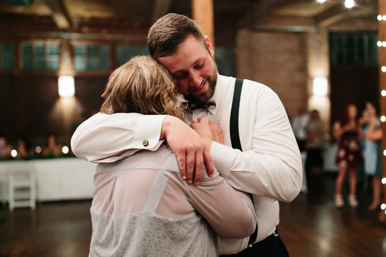 Virginia + Kory | emotional, industrial style wedding with dusty blue, ivory, and gold accents at the Mckinney Cotton Mill by North Texas Wedding Photographer Rachel Meagan Photography | 109