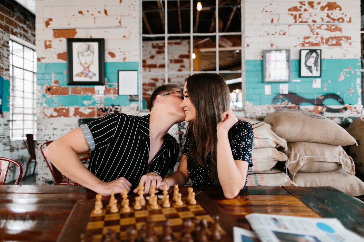 Annie + Max | cozy coffee shop, dowtown Fort Smith, Hawksbill Crag stylish engagement session in the Ozark National Forest by Destination Wedding Photographer Rachel Meagan Photography | 004